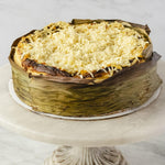 Load image into Gallery viewer, Whole Bibingka Cheesecake with Salted Egg, Cheddar, and Coconut Flakes dessert or pastry
